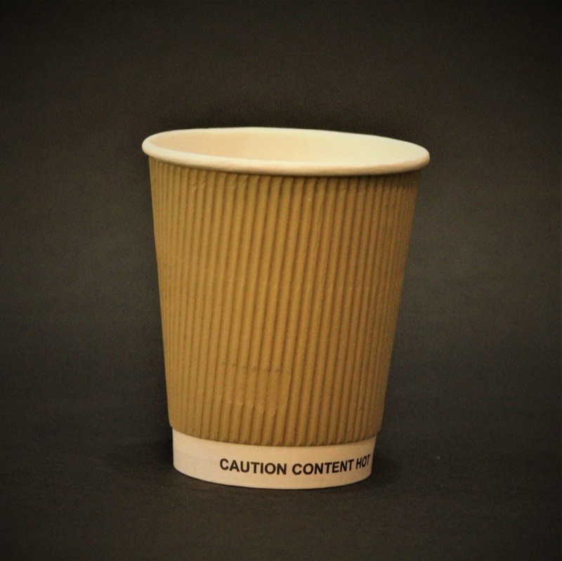 A kraft rippled double-wall cup printed with caution content hot.